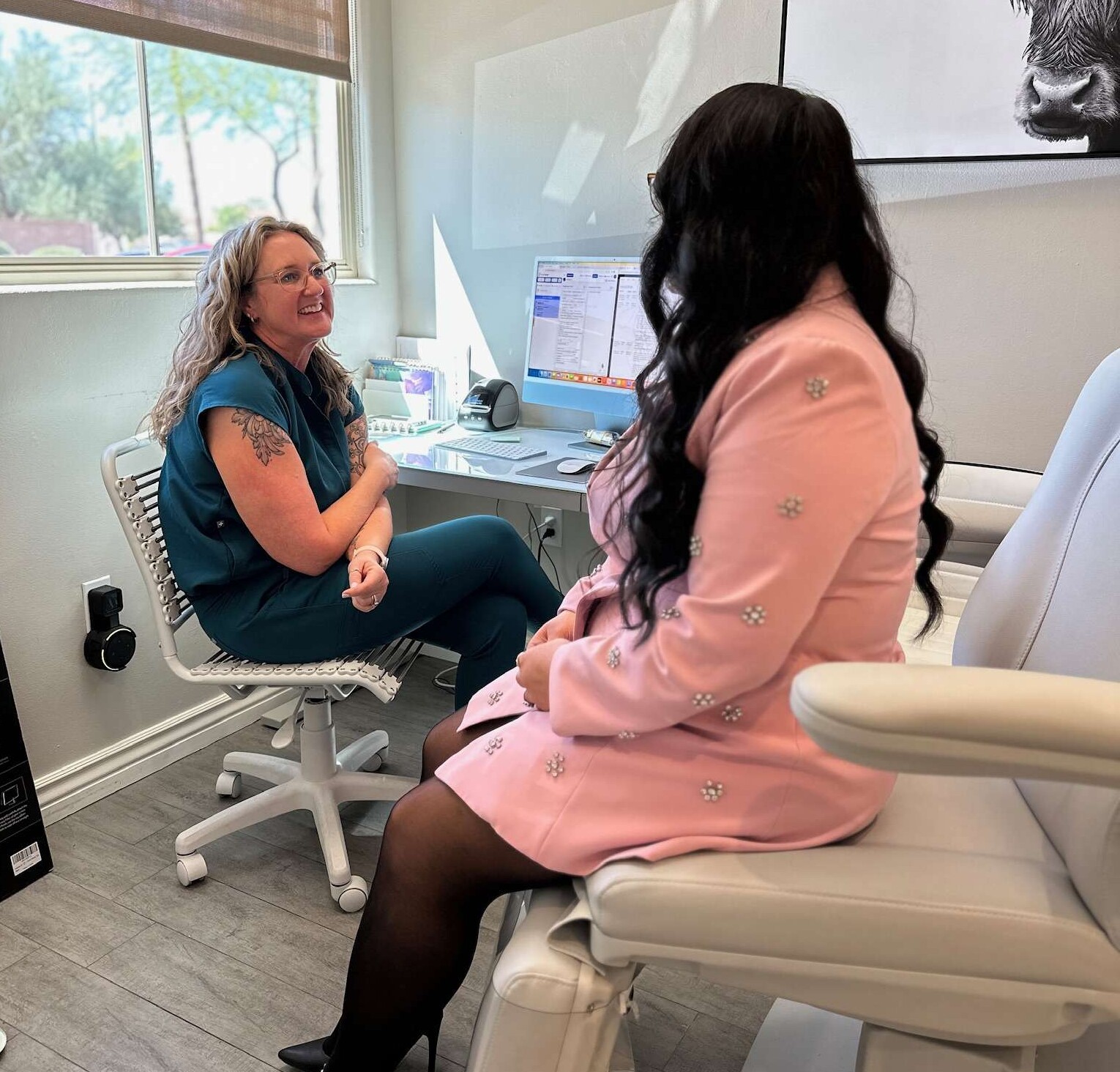 melynda talking to patient about treatments at AZ Vitality and Wellness