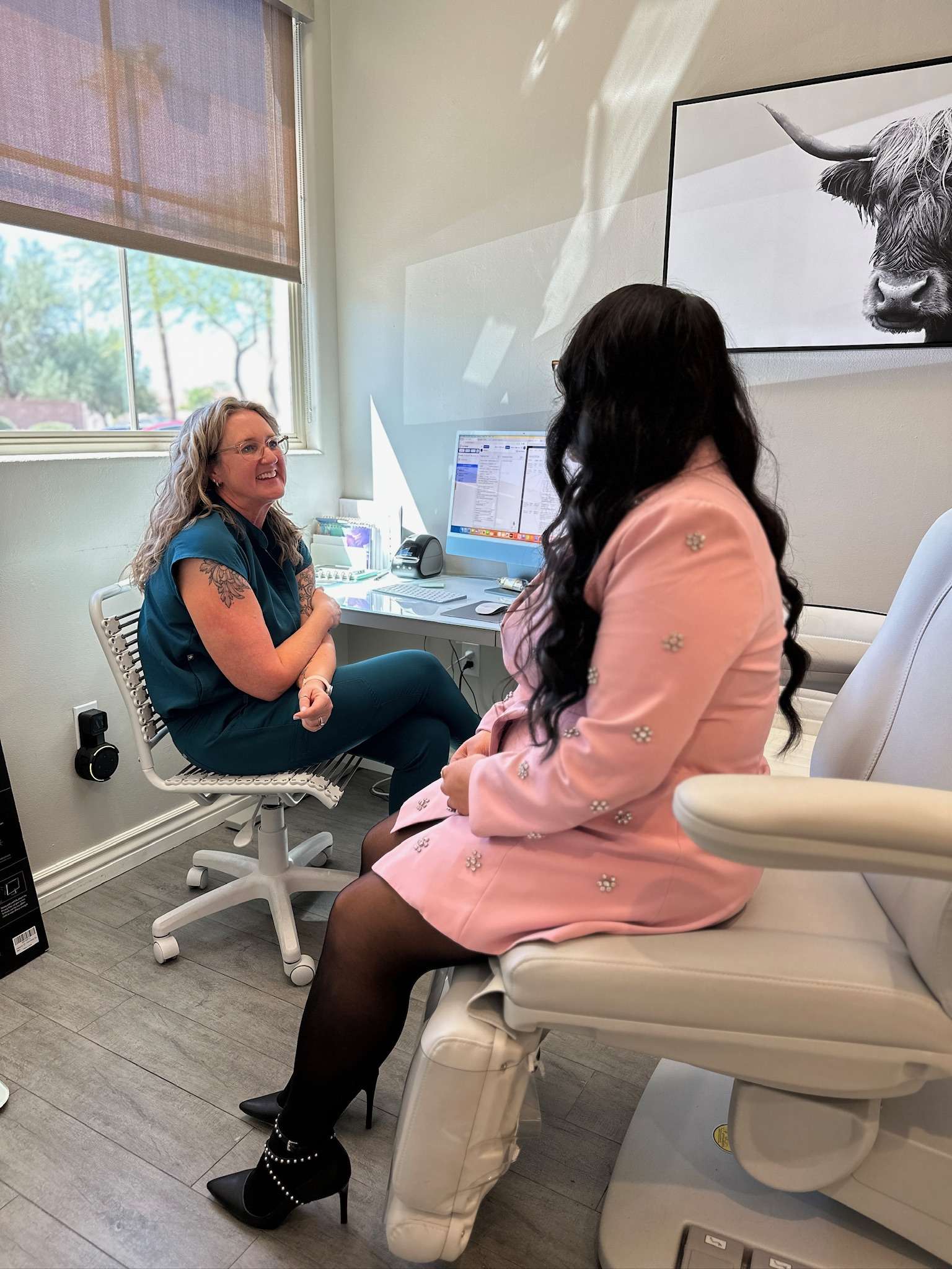 melynda talking to patient about treatments at AZ Vitality and Wellness